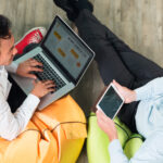 two business men working tablet laptop